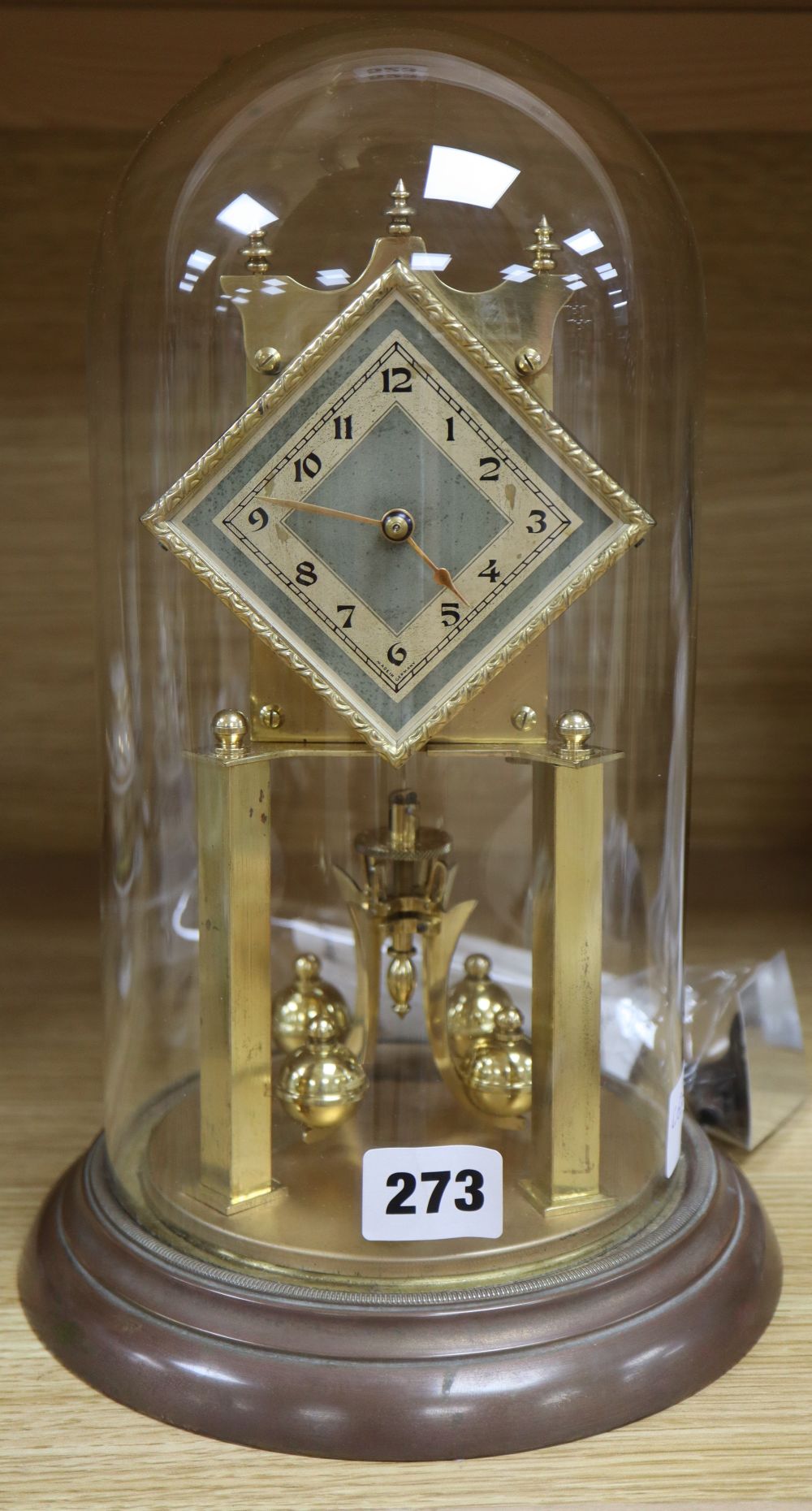 A brass 400-day clock under dome